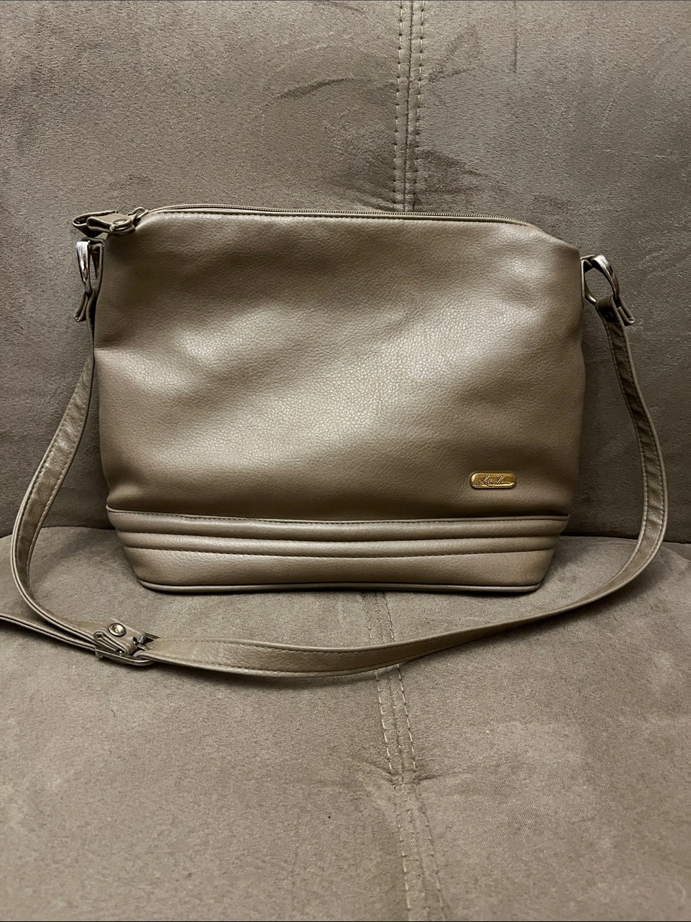 Kathie Lee Taupe Pebbled Crossbody with Gold Logo Plate